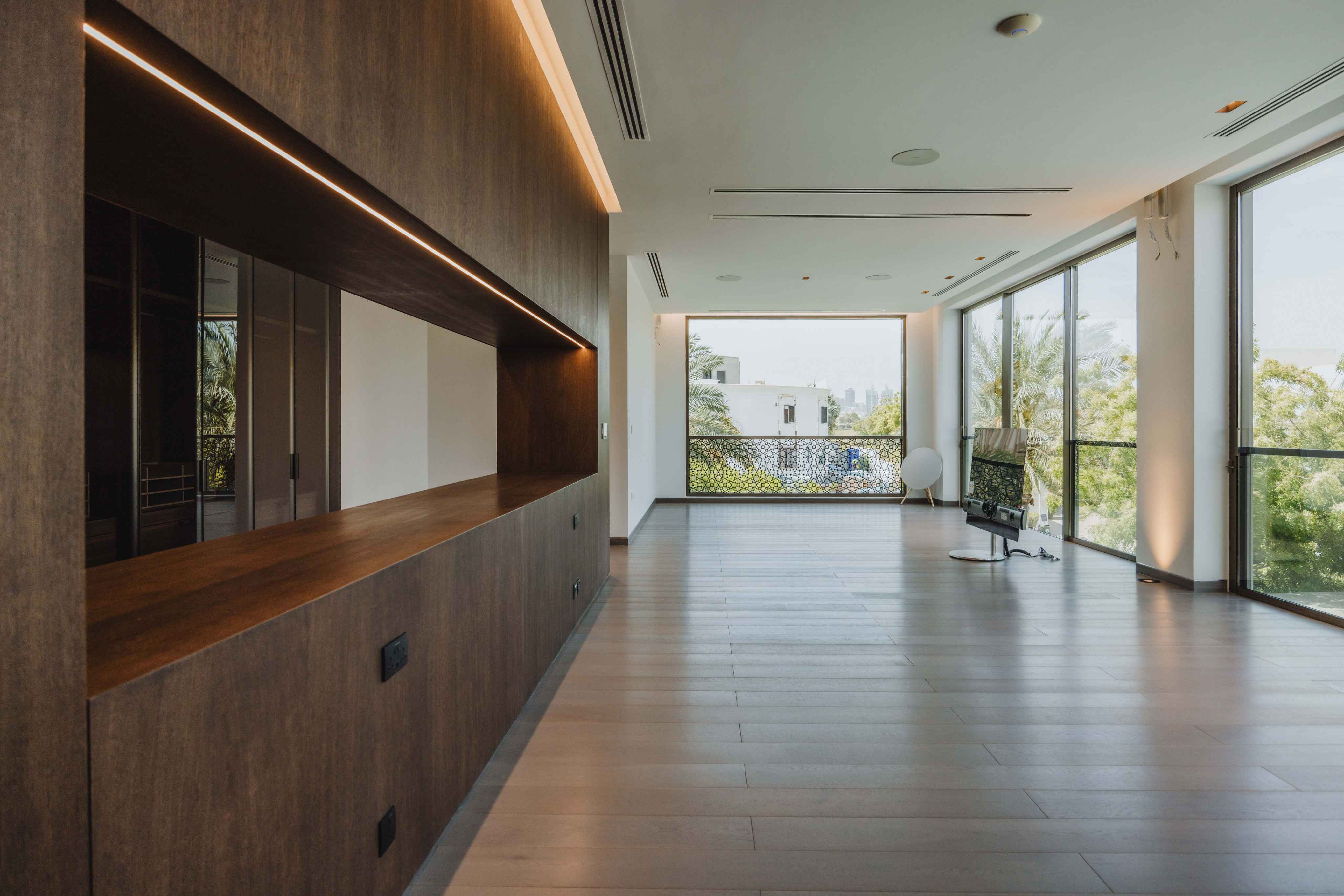 Linear profile lighting along a corridor ceiling