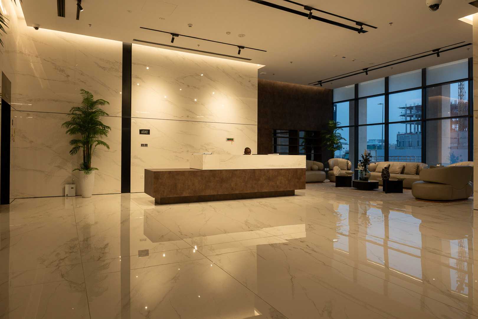 Track lighting and spotlights illuminating an art piece